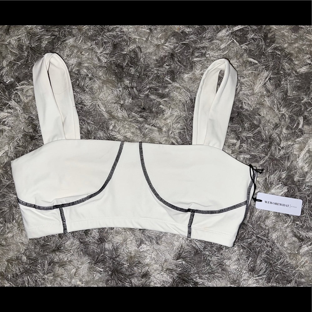 Never worn with tags WEWOREWHAT active wear corset top in white